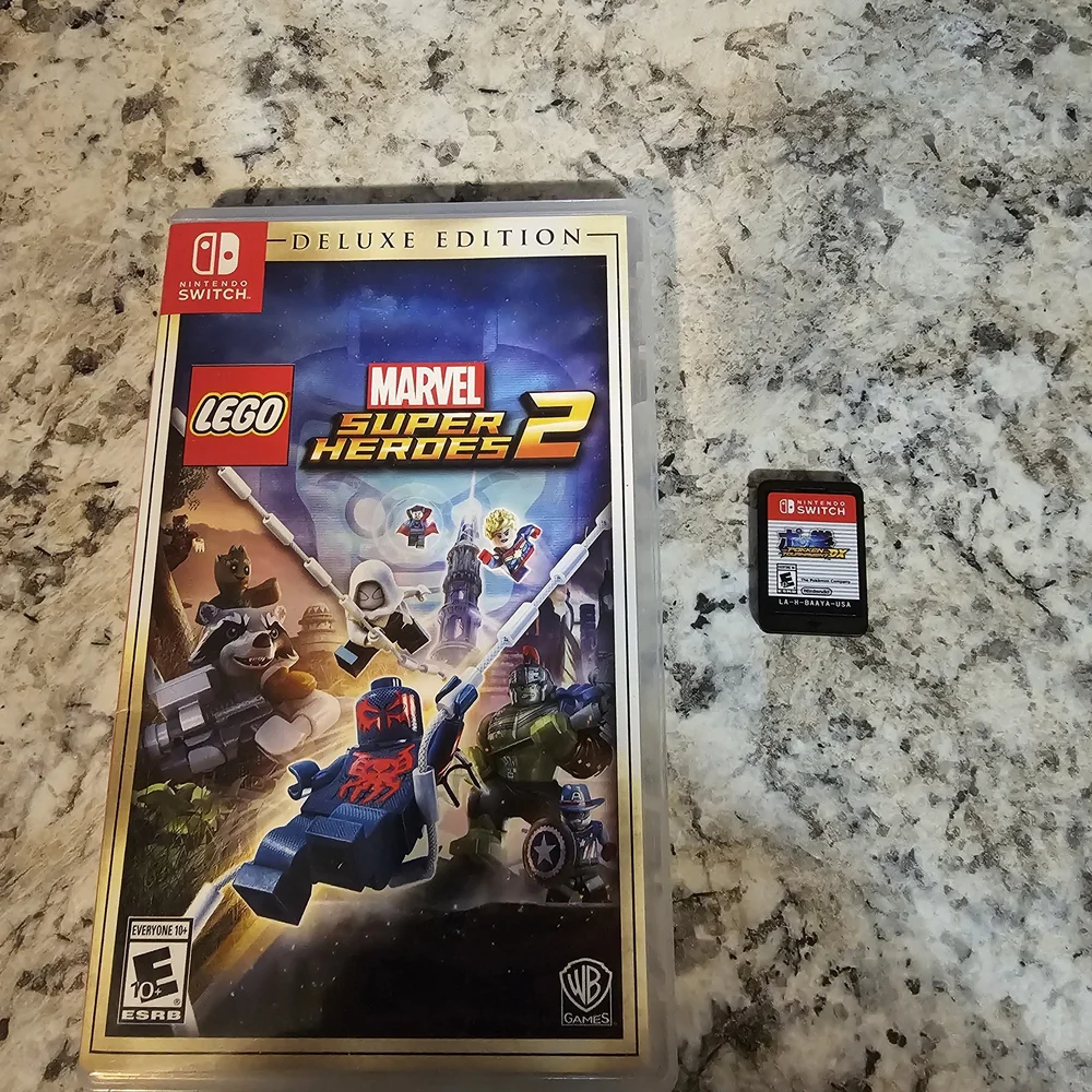 Nintendo Switch with Gray Joy-Con Controllers, Joy Con Grip, And 2 Games. No Doc